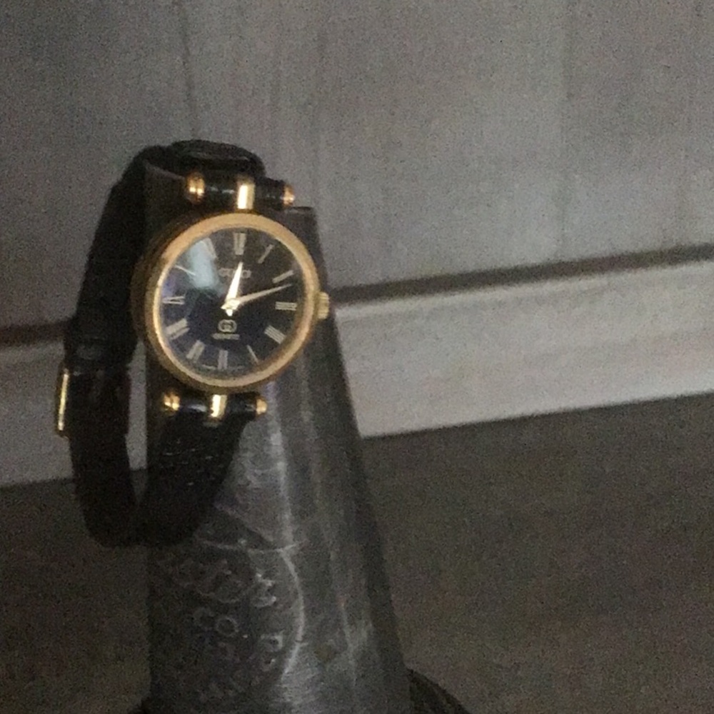 Gucci black and gold women’s watch
